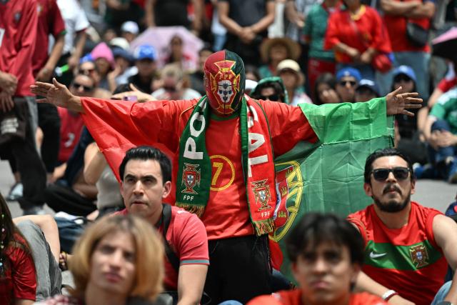 Fans of Portugal gather at the FIFA Fan Fest during the 2026 FIFA World Cup round-of-16 football match between Portugal and Spain at the Zocalo square in Mexico City, Mexico, on July 6, 2026 (Photo by YURI CORTEZ / AFP)