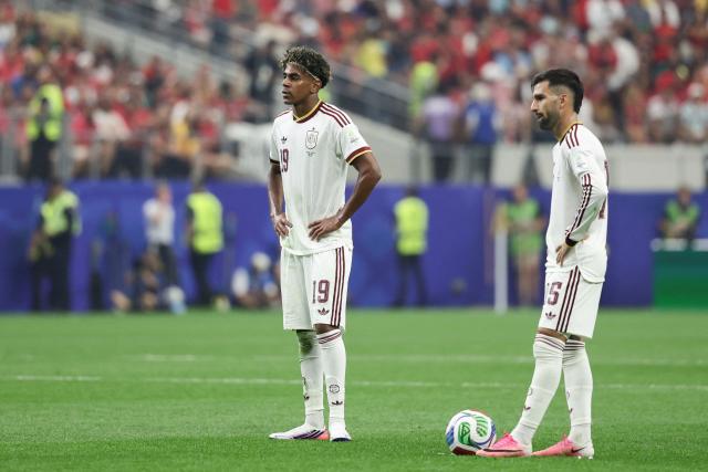 Spain's forward #19 Lamine Yamal gestures next to midfielder #15 Alex Baena during the 2026 World Cup round of 16 football match between Portugal and Spain at the Dallas Stadium in Arlington on July 6, 2026. (Photo by Aric Becker / AFP)