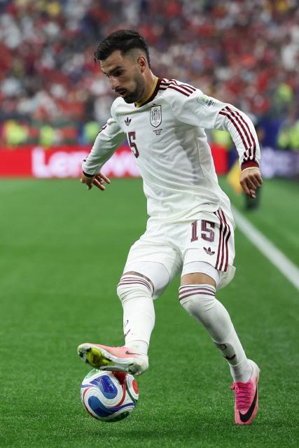 Spain's midfielder #15 Alex Baena runs with the ball during the 2026 World Cup round of 16 football match between Portugal and Spain at the Dallas Stadium in Arlington on July 6, 2026. (Photo by Aric Becker / AFP)
