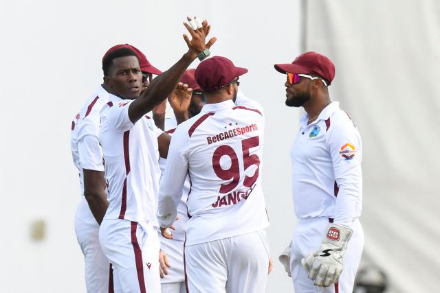 Shamar Joseph (L) of West Indies celebrates the dismissal of Lahiru Udara of Sri Lanka during the 4th day of the 2nd Test between Sri Lanka and West Indies at Vivian Richards Cricket Stadium in North Sound, Antigua and Barbuda, on July 6, 2026. (Photo by Randy Brooks / AFP)