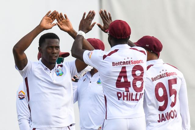 Shamar Joseph (L) of West Indies celebrates the dismissal of Lahiru Udara of Sri Lanka during the 4th day of the 2nd Test between Sri Lanka and West Indies at Vivian Richards Cricket Stadium in North Sound, Antigua and Barbuda, on July 6, 2026. (Photo by Randy Brooks / AFP)