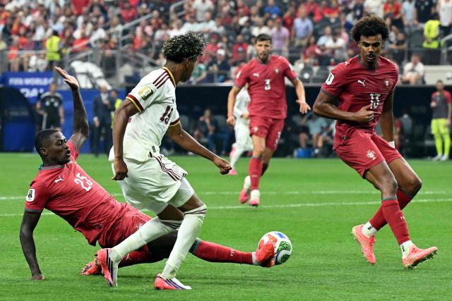Spain's forward #19 Lamine Yamal, Portugal's defender #25 Nuno Mendes and midfielder #13 Renato Veiga fight for the ball during the 2026 World Cup round of 16 football match between Portugal and Spain at the Dallas Stadium in Arlington on July 6, 2026. (Photo by RONALDO SCHEMIDT / AFP)