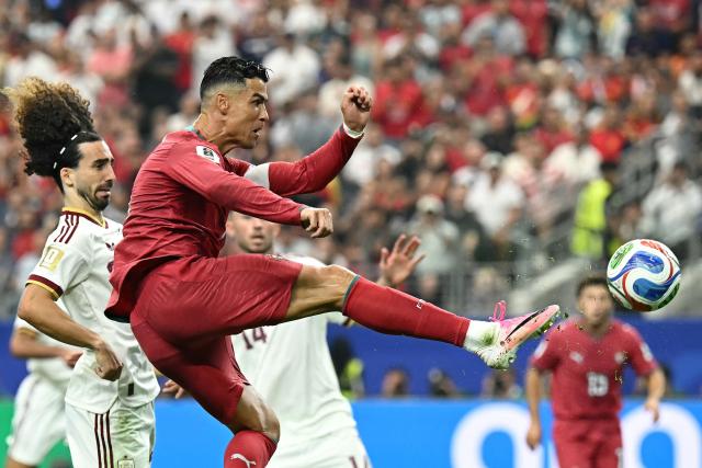 Portugal's forward #07 Cristiano Ronaldo controls the ball next to Spain's defender #24 Marc Cucurella during the 2026 World Cup round of 16 football match between Portugal and Spain at the Dallas Stadium in Arlington on July 6, 2026. (Photo by Paul ELLIS / AFP)