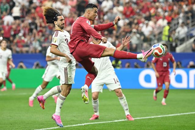Portugal's forward #07 Cristiano Ronaldo controls the ball next to Spain's defender #24 Marc Cucurella during the 2026 World Cup round of 16 football match between Portugal and Spain at the Dallas Stadium in Arlington on July 6, 2026. (Photo by Paul ELLIS / AFP)