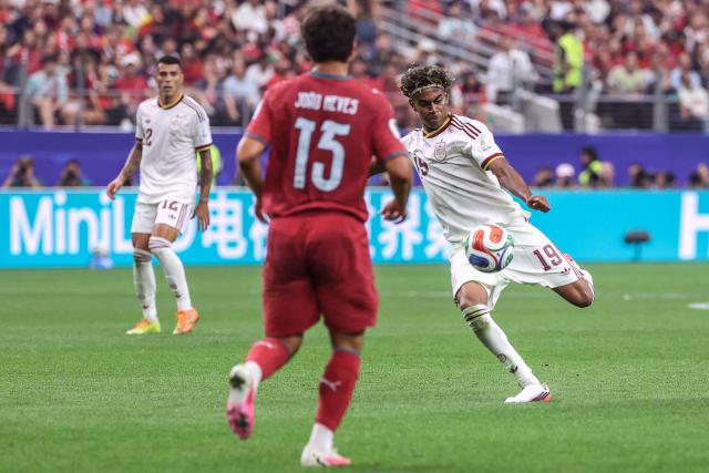 Spain's forward #19 Lamine Yamal kicks the ball during the 2026 World Cup round of 16 football match between Portugal and Spain at the Dallas Stadium in Arlington on July 6, 2026. (Photo by Thomas COEX / AFP)