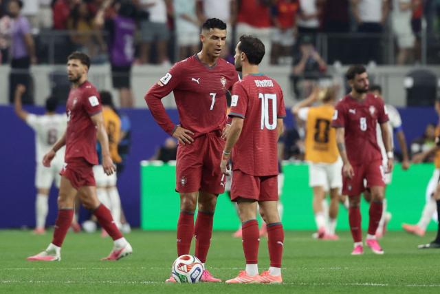 Portugal's forward #07 Cristiano Ronaldo and midfielder #10 Bernardo Silva react after Spain's first goal scored by midfielder #06 Mikel Merino (unseen) during the 2026 World Cup round of 16 football match between Portugal and Spain at the Dallas Stadium in Arlington on July 6, 2026. (Photo by Aric Becker / AFP)