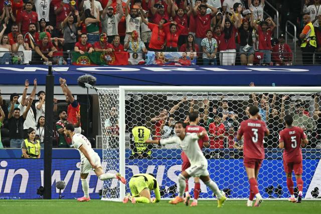 Spain's midfielder #06 Mikel Merino (L) celebrates scoring his team's first goal during the 2026 World Cup round of 16 football match between Portugal and Spain at the Dallas Stadium in Arlington on July 6, 2026. (Photo by Paul ELLIS / AFP)