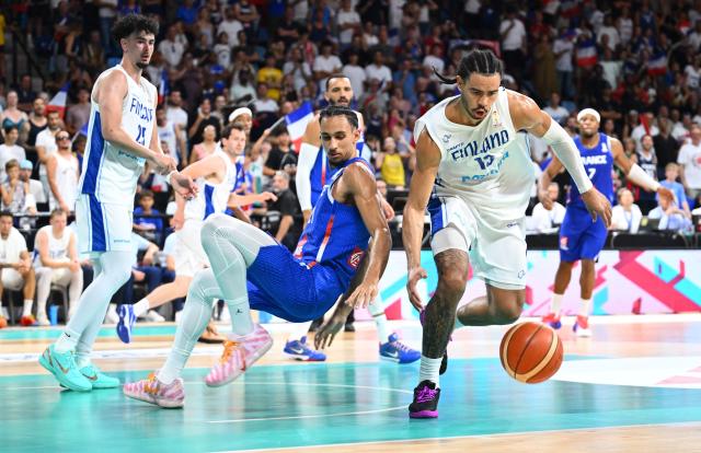 Finland's Olivier Nkamhoua (R) vies with France's #21 Zaccharie Risacher during the qualifier basketball match between France and Finland for the men's 2027 FIBA World Championships at the Palais des Sports in Pau, south-western France on July 6, 2026. (Photo by Gaizka IROZ / AFP)