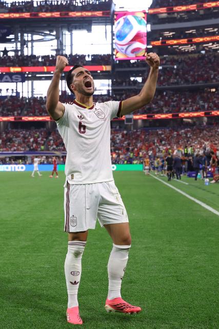 Spain's midfielder #06 Mikel Merino celebrates scoring his team's first goal during the 2026 World Cup round of 16 football match between Portugal and Spain at the Dallas Stadium in Arlington on July 6, 2026. (Photo by Thomas COEX / AFP)