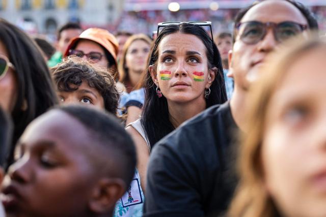 Portugal supporters view the Portugal versus Spain 2026 World Cup round of 16 football match played in Arlington, Texas, at a fan zone in Praca do Comercio in Lisbon on July 6, 2026. (Photo by HENRIQUE CASINHAS / AFP)