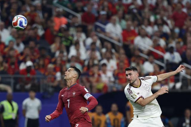 Portugal's forward #07 Cristiano Ronaldo and Spain's defender #14 Aymeric Laporte fight for the ball during the 2026 World Cup round of 16 football match between Portugal and Spain at the Dallas Stadium in Arlington on July 6, 2026. (Photo by Aric Becker / AFP)