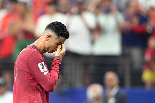 Portugal's forward #07 Cristiano Ronaldo reacts after losing the 2026 World Cup round of 16 football match between Portugal and Spain at the Dallas Stadium in Arlington on July 6, 2026. (Photo by RONALDO SCHEMIDT / AFP)