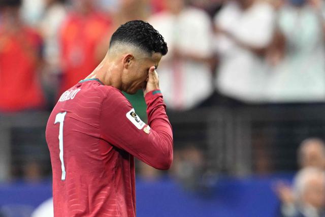 Portugal's forward #07 Cristiano Ronaldo reacts after losing the 2026 World Cup round of 16 football match between Portugal and Spain at the Dallas Stadium in Arlington on July 6, 2026. (Photo by RONALDO SCHEMIDT / AFP)