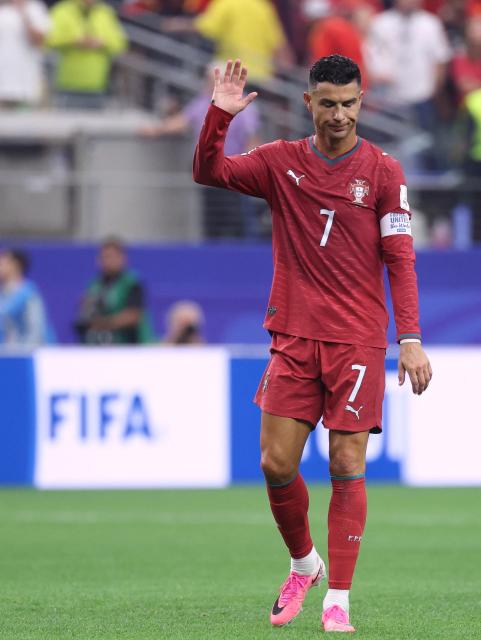 Portugal's forward #07 Cristiano Ronaldo waves to fans after losing the 2026 World Cup round of 16 football match between Portugal and Spain at the Dallas Stadium in Arlington on July 6, 2026. (Photo by Thomas COEX / AFP)