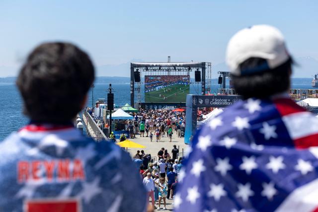 USA fans watch the FIFA World Cup Round of 16 match between Portugal and Spain at the Seattle Soccer Celebration on Pier 58 in Seattle, Washington, on July 6, 2026. (Photo by Jason Redmond / AFP)