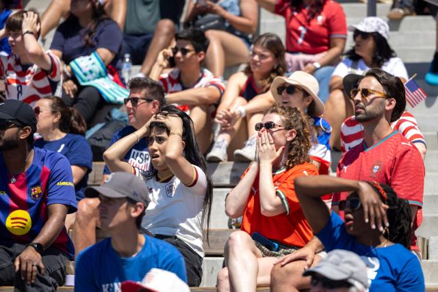 Fans react as they watch the World Cup Round of 16 match between Portugal and Spain at the Seattle Soccer Celebration on Pier 58 in Seattle, Washington, on July 6, 2026. (Photo by Jason Redmond / AFP)