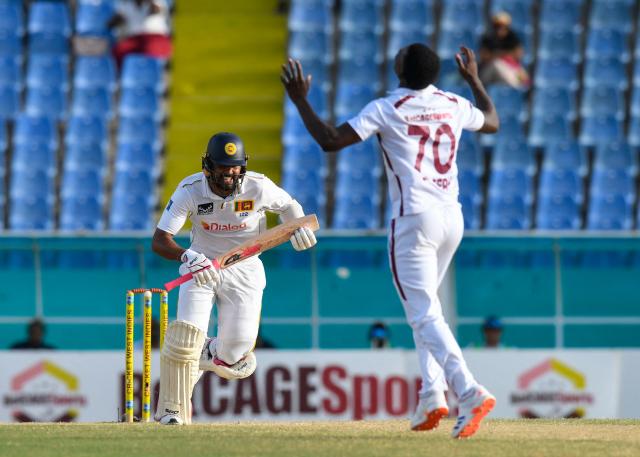 Dinesh Chandimal (L) of Sri Lanka gets runs off Shamar Joseph (R) of West Indies during the 4th day of the 2nd Test between Sri Lanka and West Indies at Vivian Richards Cricket Stadium in North Sound, Antigua and Barbuda, on July 6, 2026. (Photo by Randy Brooks / AFP)