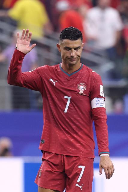 Portugal's forward #07 Cristiano Ronaldo waves to fans after losing the 2026 World Cup round of 16 football match between Portugal and Spain at the Dallas Stadium in Arlington on July 6, 2026. (Photo by Thomas COEX / AFP)