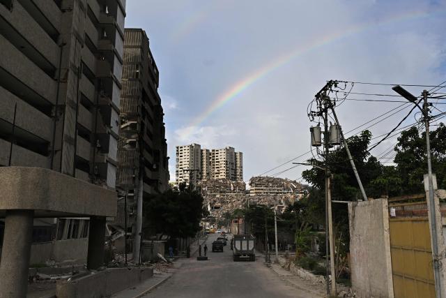 A rainbow appears above buildings damaged by the June 24 earthquakes in Catia la Mar, La Guaira state, Venezuela, on July 6, 2026. The twin earthquakes that struck Venezuela on June 24 have claimed the lives of at least 3,535 people, the Venezuelan government reported on July 5. (Photo by Juan BARRETO / AFP)