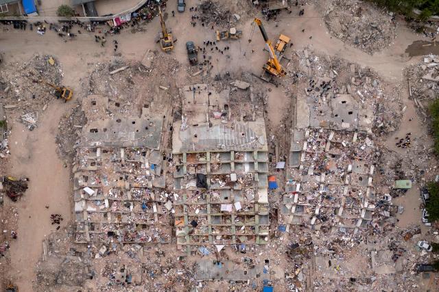 This aerial view shows collapsed buildings in Caraballeda, La Guaira state, Venezuela, on July 6, 2026, following the June 24 earthquakes. The twin earthquakes that struck Venezuela on June 24 have claimed the lives of at least 3,535 people, the Venezuelan government reported on July 6. (Photo by Federico PARRA / AFP)
