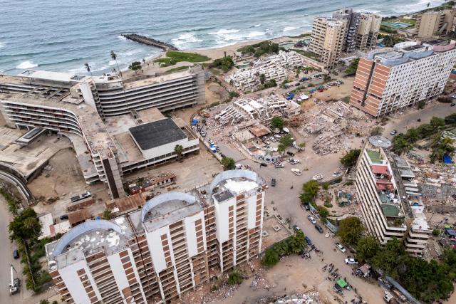 This aerial view shows several collapsed buildings along the coastal strip in Caraballeda, La Guaira state, Venezuela, on July 6, 2026, following the June 24 earthquakes. The twin earthquakes that struck Venezuela on June 24 have claimed the lives of at least 3,535 people, the Venezuelan government reported on July 6. (Photo by Federico PARRA / AFP)