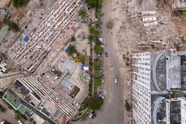 This aerial view shows collapsed buildings in Caraballeda, La Guaira state, Venezuela, on July 6, 2026, following the June 24 earthquakes. The twin earthquakes that struck Venezuela on June 24 have claimed the lives of at least 3,535 people, the Venezuelan government reported on July 6. (Photo by Federico PARRA / AFP)