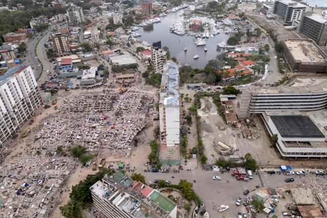 This aerial view shows several collapsed buildings along the coastal strip in Caraballeda, La Guaira state, Venezuela, on July 6, 2026, following the June 24 earthquakes. The twin earthquakes that struck Venezuela on June 24 have claimed the lives of at least 3,535 people, the Venezuelan government reported on July 6. (Photo by Federico PARRA / AFP)
