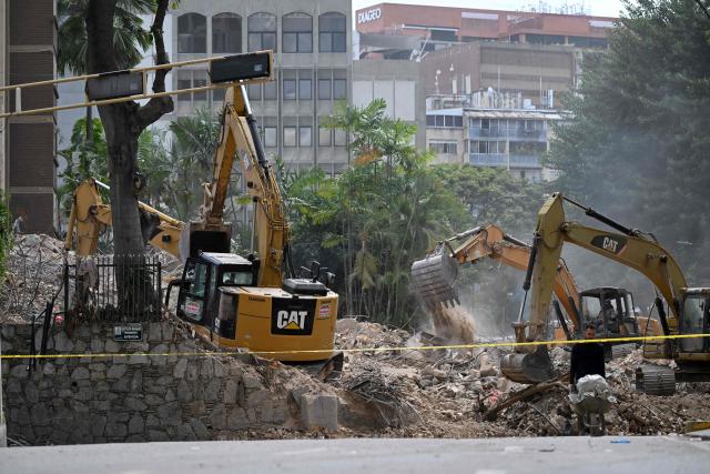 Heavy machinery removes debris form a collapsed building at the Chacao municipality in Caracas, on July 6, 2026, following the June 24 earthquakes that hit the region. The death toll from Venezuela's twin earthquakes has risen to 3,535, with more than 16,700 injured in the disaster, according to updated official figures released on July 6. (Photo by Raul ARBOLEDA / AFP)