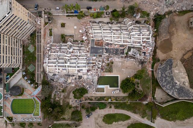 This aerial view shows collapsed buildings in Caraballeda, La Guaira state, Venezuela, on July 6, 2026, following the June 24 earthquakes. The twin earthquakes that struck Venezuela on June 24 have claimed the lives of at least 3,535 people, the Venezuelan government reported on July 6. (Photo by Federico PARRA / AFP)