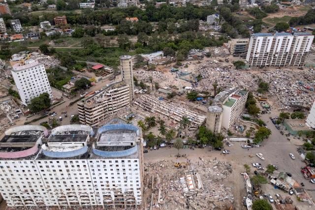 This aerial view shows collapsed buildings in Caraballeda, La Guaira state, Venezuela, on July 6, 2026, following the June 24 earthquakes. The twin earthquakes that struck Venezuela on June 24 have claimed the lives of at least 3,535 people, the Venezuelan government reported on July 6. (Photo by Federico PARRA / AFP)