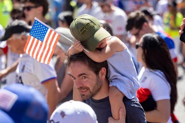 US fans march through Pioneer Square before the 2026 World Cup round of 16 match between USA and Belgium in Seattle, Washington, on July 6, 2026. (Photo by Jason Redmond / AFP)