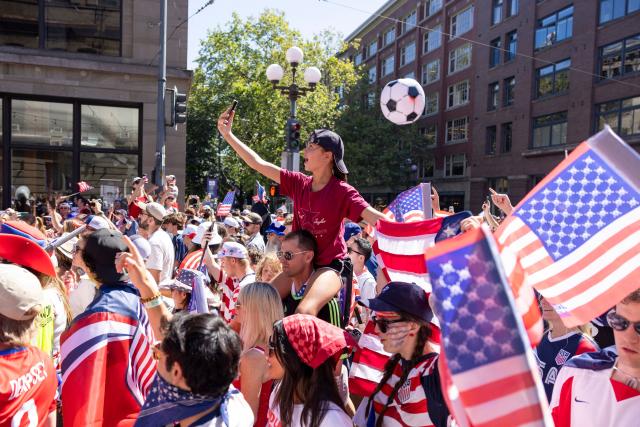 US fans march through Pioneer Square before the 2026 World Cup round of 16 match between USA and Belgium in Seattle, Washington, on July 6, 2026. (Photo by Jason Redmond / AFP)