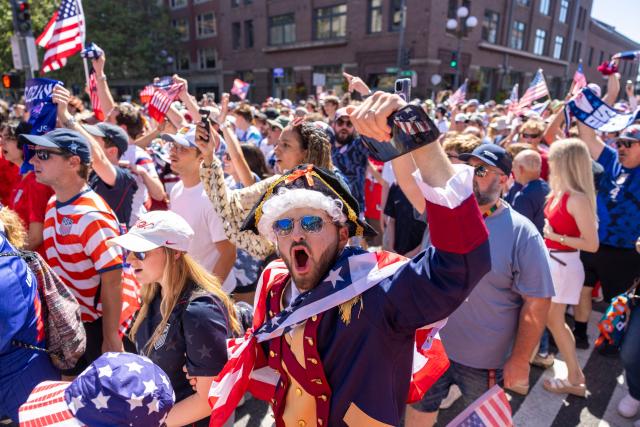 US fans march through Pioneer Square before the 2026 World Cup round of 16 match between USA and Belgium in Seattle, Washington, on July 6, 2026. (Photo by Jason Redmond / AFP)