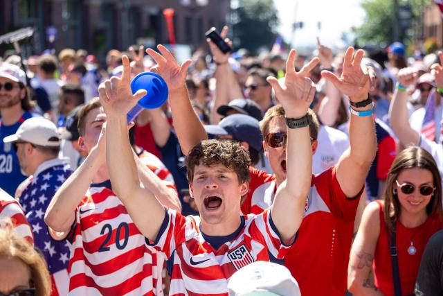 US fans march through Pioneer Square before the 2026 World Cup round of 16 match between USA and Belgium in Seattle, Washington, on July 6, 2026. (Photo by Jason Redmond / AFP)