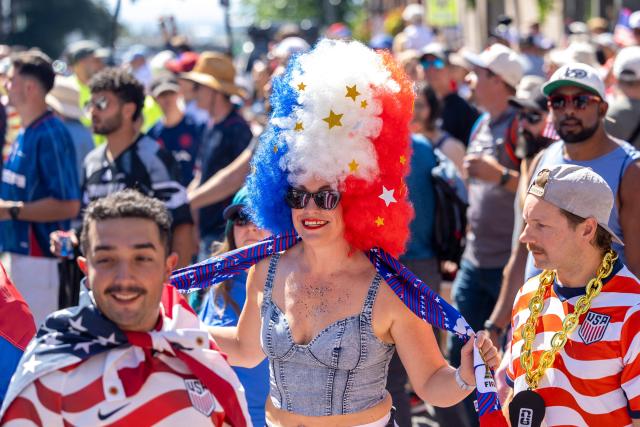 US fans march through Pioneer Square before the 2026 World Cup round of 16 match between USA and Belgium in Seattle, Washington, on July 6, 2026. (Photo by Jason Redmond / AFP)