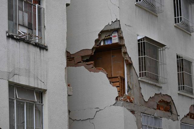 View of a damaged building which will undergo official inspection to determine its habitability in Caracas, on July 6, 2026, following the June 24 earthquakes that hit the region. The death toll from Venezuela's twin earthquakes has risen to 3,535, with more than 16,700 injured in the disaster, according to updated official figures released on July 6. (Photo by Raul ARBOLEDA / AFP)