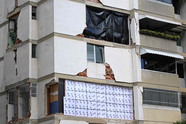 View of a damaged building which will undergo official inspection to determine its habitability in Caracas, on July 6, 2026, following the June 24 earthquakes that hit the region. The death toll from Venezuela's twin earthquakes has risen to 3,535, with more than 16,700 injured in the disaster, according to updated official figures released on July 6. (Photo by Raul ARBOLEDA / AFP)