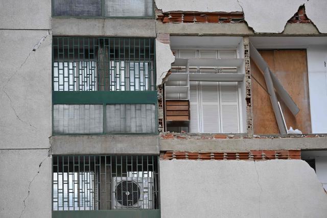 View of a damaged building which will undergo official inspection to determine its habitability in Caracas, on July 6, 2026, following the June 24 earthquakes that hit the region. The death toll from Venezuela's twin earthquakes has risen to 3,535, with more than 16,700 injured in the disaster, according to updated official figures released on July 6. (Photo by Raul ARBOLEDA / AFP)
