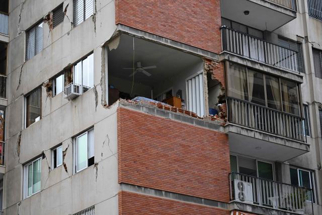 View of a damaged building which will undergo official inspection to determine its habitability in Caracas, on July 6, 2026, following the June 24 earthquakes that hit the region. The death toll from Venezuela's twin earthquakes has risen to 3,535, with more than 16,700 injured in the disaster, according to updated official figures released on July 6. (Photo by Raul ARBOLEDA / AFP)