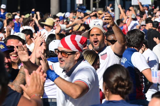 US fans cheer while watching the 2026 World Cup round of 16 match between USA and Belgium at the Pasadena Civic Auditorium Plaza fan zone in Pasadena, California, on July 6, 2026. (Photo by Frederic J. Brown / AFP)
