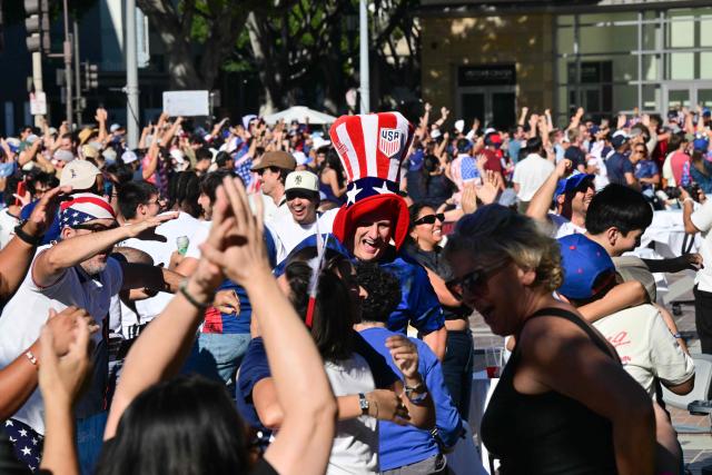 US fans cheer while watching the 2026 World Cup round of 16 match between USA and Belgium at the Pasadena Civic Auditorium Plaza fan zone in Pasadena, California, on July 6, 2026. (Photo by Frederic J. Brown / AFP)