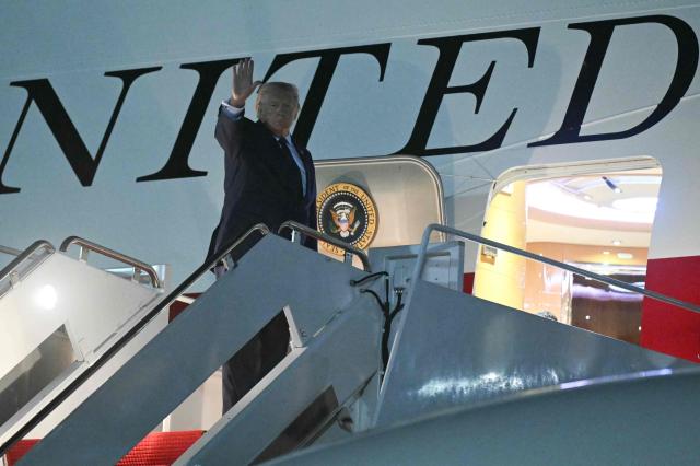 US President Donald Trump waves as he boards Air Force One, at Joint Base Andrews, Maryland, on July 6, 2026. Trump is traveling to Ankara, Turkey to attend a NATO summit. (Photo by SAUL LOEB / AFP)