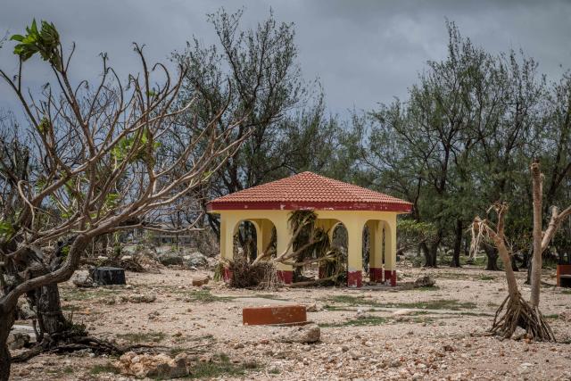 A general view shows debris washed ashore by high waves at a park in the aftermath of Super Typhoon Bavi in Guam on July 7, 2026. (Photo by Yuichi YAMAZAKI / AFP)
