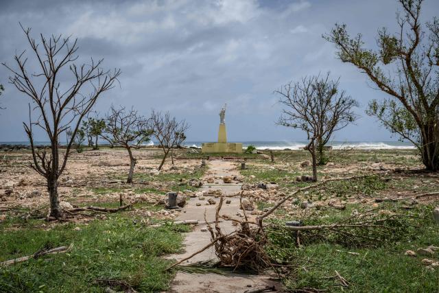 A general view shows debris washed ashore by high waves at a park in the aftermath of Super Typhoon Bavi in Guam on July 7, 2026. (Photo by Yuichi YAMAZAKI / AFP)