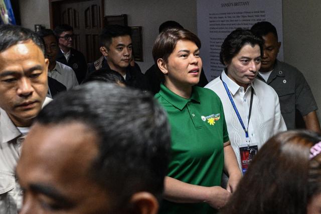 Philippine Vice President Sara Duterte arrives before the start of the impeachment trial at the Senate of the Philippines in Pasay, Metro Manila on July 7, 2026. (Photo by NOEL CELIS / POOL / AFP)