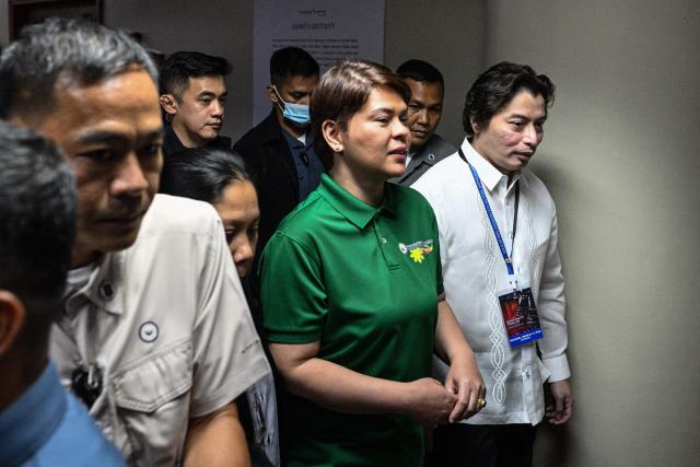 Philippine Vice President Sara Duterte arrives before the start of the impeachment trial at the Senate of the Philippines in Pasay, Metro Manila on July 7, 2026. (Photo by NOEL CELIS / POOL / AFP)