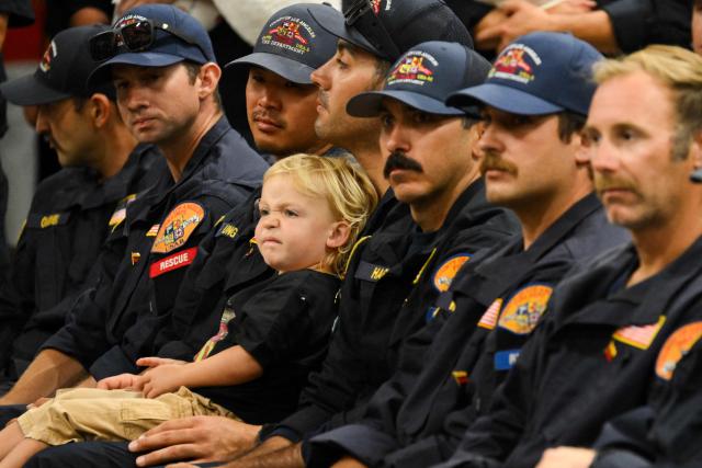 Members of the Los Angeles County Fire Department USA-2 international urban search and rescue team attend a welcoming ceremony upon returning from rescue efforts following the earthquakes in Venezuela at the LACoFD Technical Operations Section in Los Angeles, California on July 6, 2026. (Photo by Patrick T. Fallon / AFP)