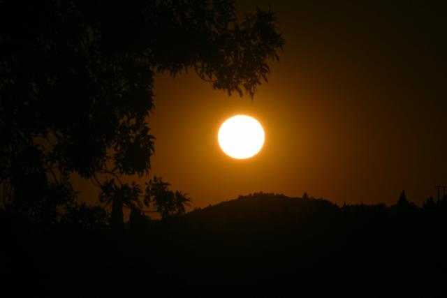 The sun rises over the town of Quillan, southern France, on July 7, 2026. (Photo by Lionel BONAVENTURE / AFP)