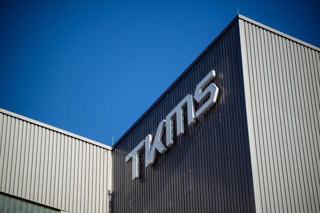(FILES) The logo of TKMS (ThyssenKrupp Marine Systems) is seen on the facade of their submarine shipyard, in Kiel, northern Germany on April 22, 2026 during a visit by the German and Indian Defence Ministers. Canada has chosen Germany's Thyssenkrupp Marine Systems TKMS to build its new multi-billion-dollar fleet of submarines, Canada's Prime Minister said on July 6, 2026, as his government works to deepen defence ties with European NATO allies. (Photo by Gregor Fischer / AFP)