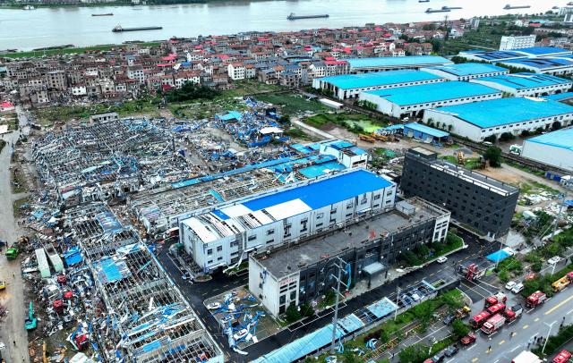 An aerial view shows destroyed and damaged buildings in an affected area after a tornado hit the city of Huanggang, in China’s central Hubei province on July 7, 2026.  (Photo by CNS / AFP) / China OUT
